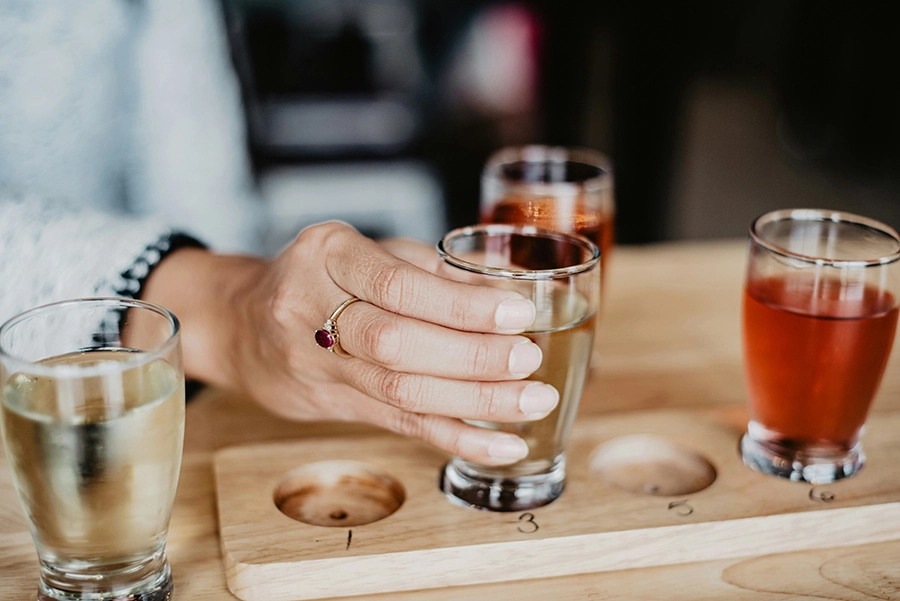 olivia-bauso-H9Deql1Qb5g-unsplash-compressed clear drinking glass on brown wooden coaster
